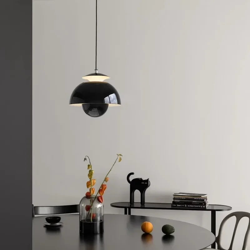Modern scandinavian Pendant Lighting shown in black over a dining table