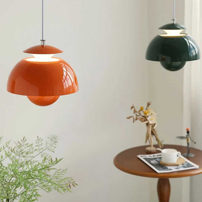 colorful modern scandinavian pendant lights shown in orange and dark green