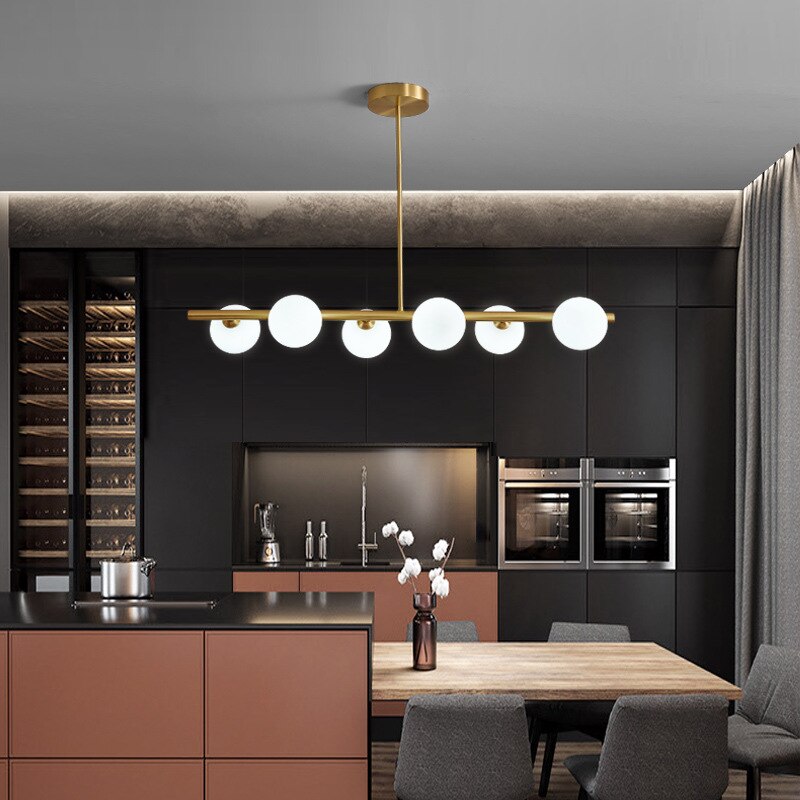 six globe modern horizontal chandelier shown over a kitchen island