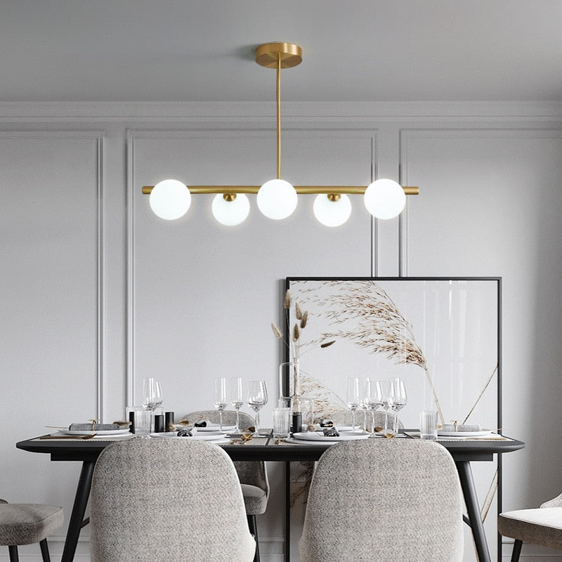 six bulb Glass Globe horizontal lighting shown in a Dining Room