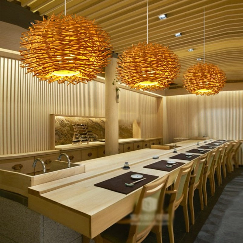 Hand Woven Rattan birds nest hanging pendant light in natural shown hanging in a restaurant