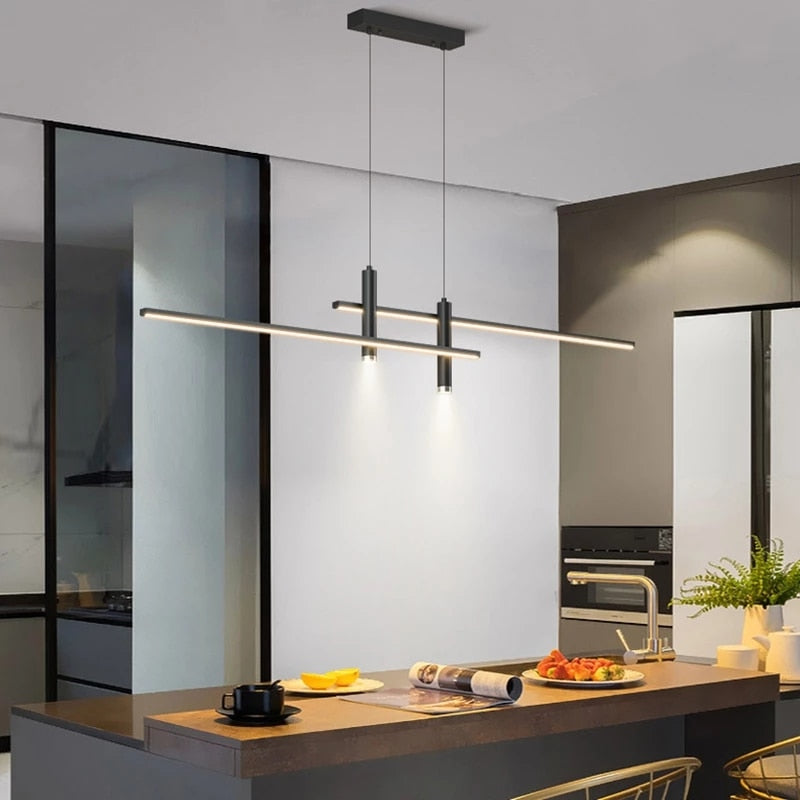 Modern Hanging Horizontal Light with two spotlights, 47 inches wide, black aluminum Frame shown illuminating a modern kitchen Island