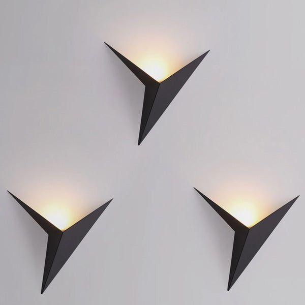 Arrangement of 3 geometroc wall sconces