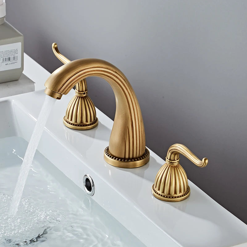 Elegant antique gold three hole deck mounted bathroom faucet shown from top view