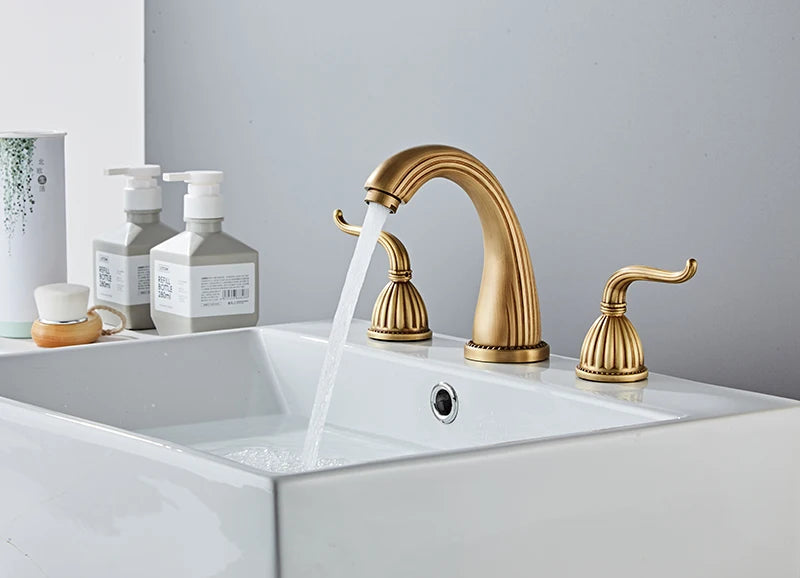 Elegant antique gold three hole deck mounted bathroom faucet shown on