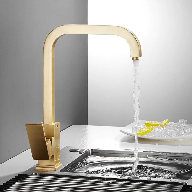 Arvo minimalist modern kitchen faucet with square base shown in the on position in brushed gold finish finish