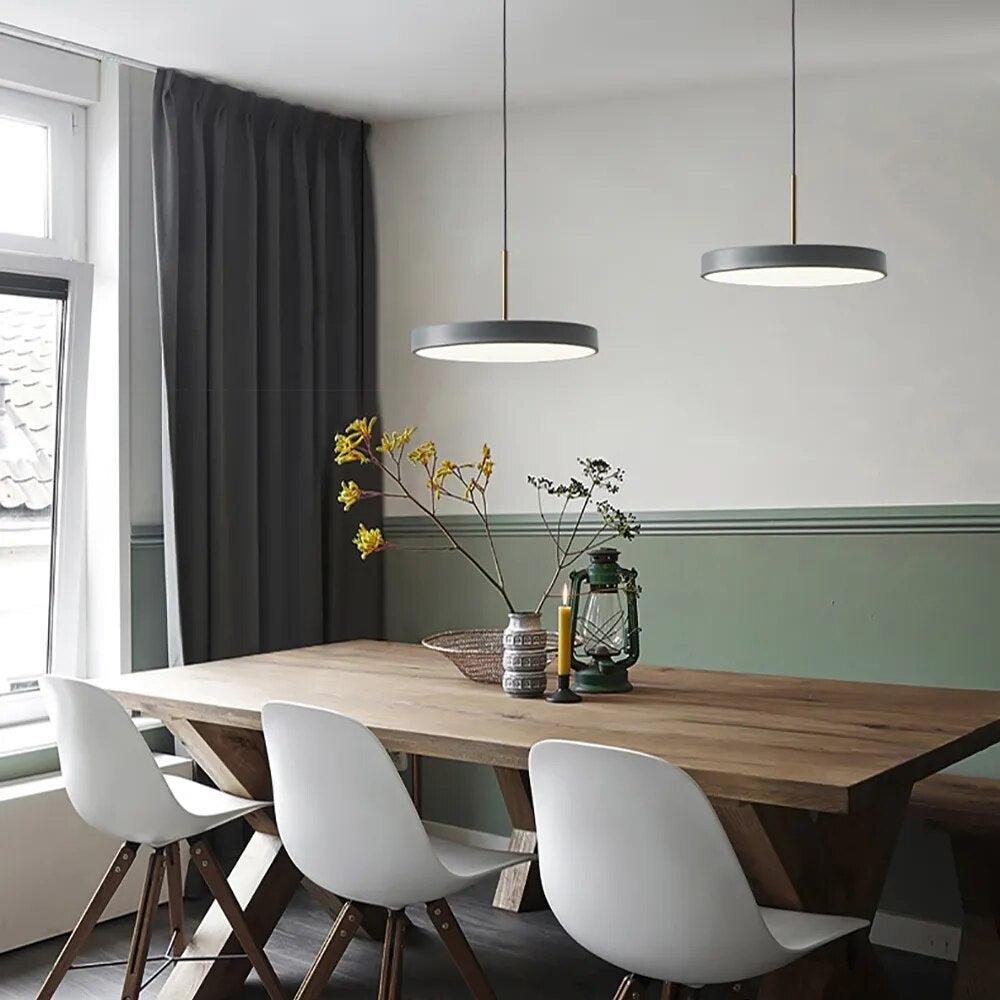 minimalisst gray hanging pendant lights in flat saucer shape shown in gray finish