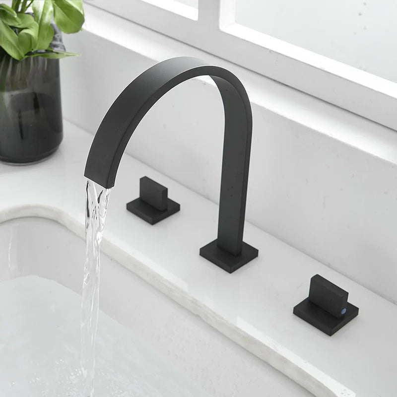 black contemporary widespread bathroom faucet with square base and handles