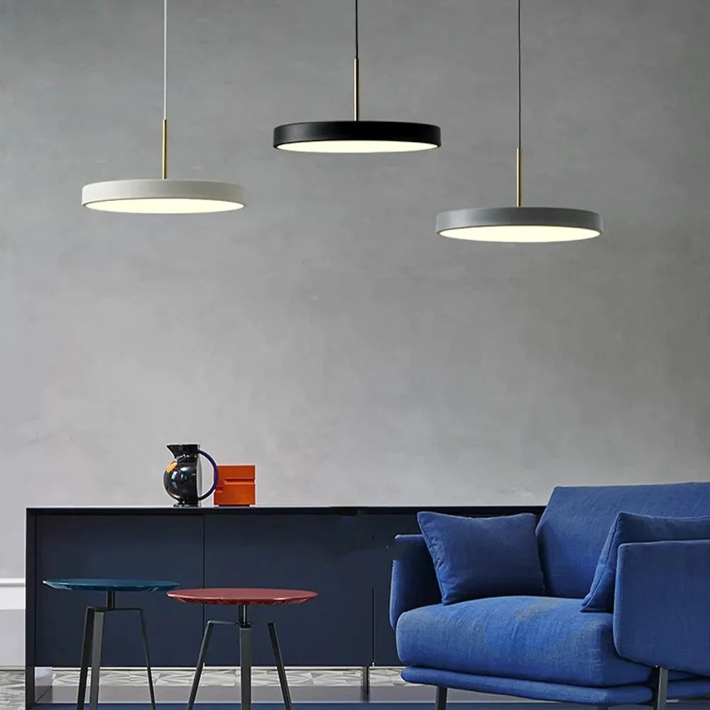 minimalisst hanging pendant lights in flat saucer shape shown hanging in a group of three in colors black, gray and white