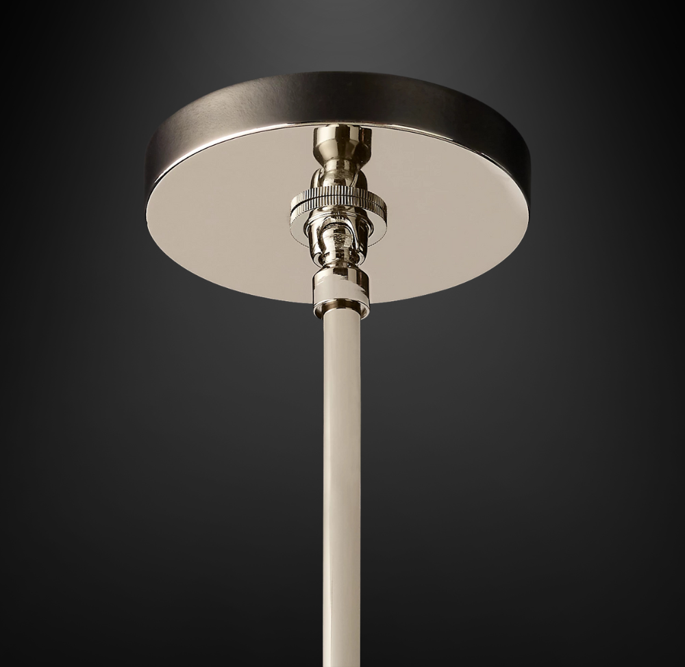 Close up of ceiling canopy of modern cylindrical Glass Pendant with polished chrome hardware