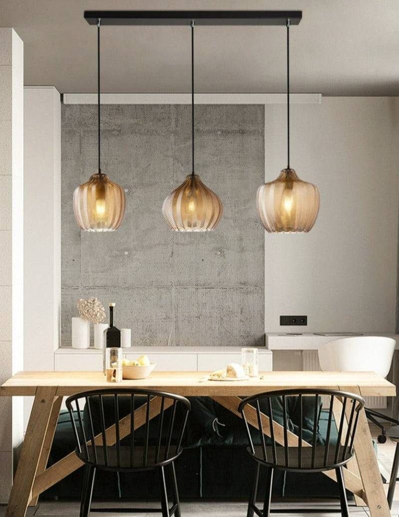 Textured Glass Light FixtureChevron Patterned Textured Glass Pendant Lights in Amber Tint shown over kitchen island