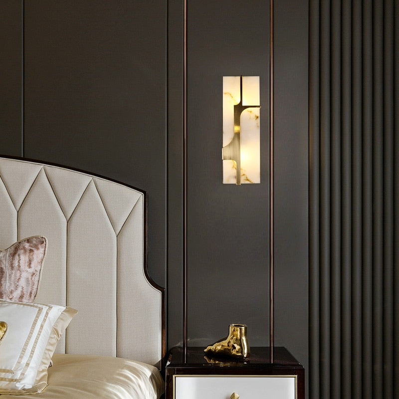 marbled glass wall sconce shown hung on bedroom wall