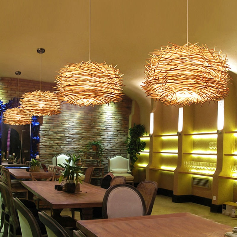 Hand Woven Rattan birds nest hanging pendant light in natural shown hanging in a retail shop