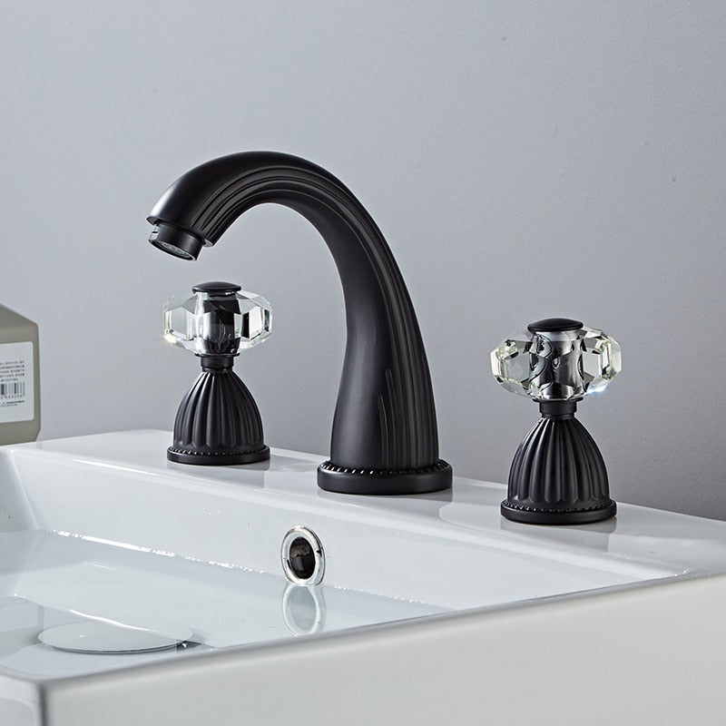 Matte black bathroom faucet  with faceted crystal handles. Fluted Design. Deck mounted, three hole with two handles