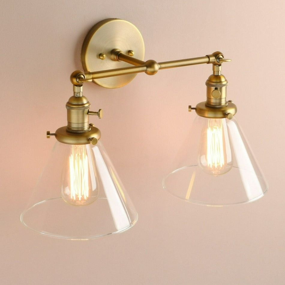 Vintage style two bulb wall sNorbell 2-bulb vintage vanity wall sconce shown in brushed gold finish