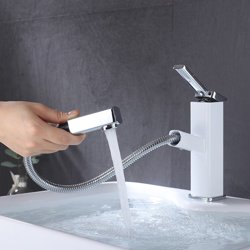 single hole modern bathroom faucet with pull out sprayer in white and chrome finish