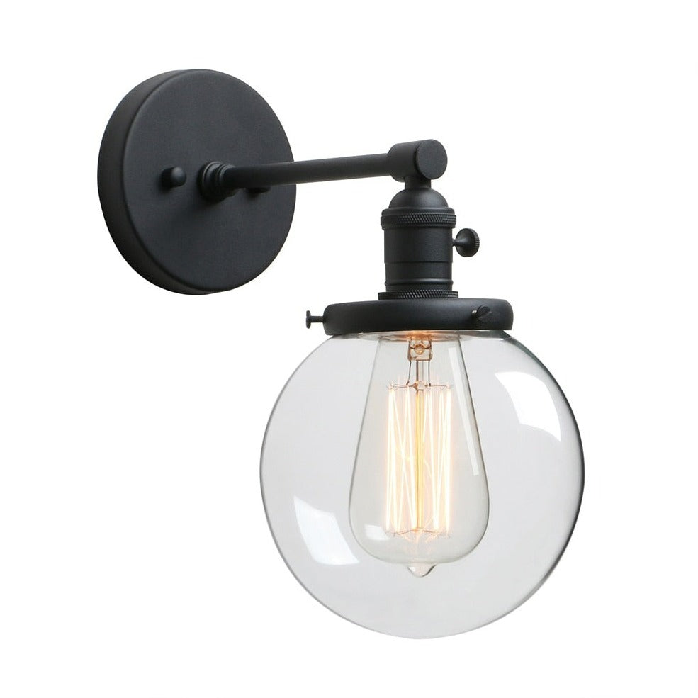 Vintage style wall sconce in matte black with clear glass globe