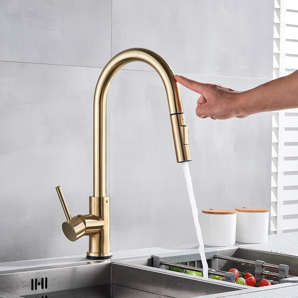 Touch activated Kitchen Faucet shown in use, Modern style in brushed gold with pull out sprayer