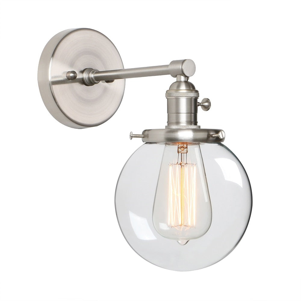 Vintage style wall sconce in brushed nickel with clear glass globe