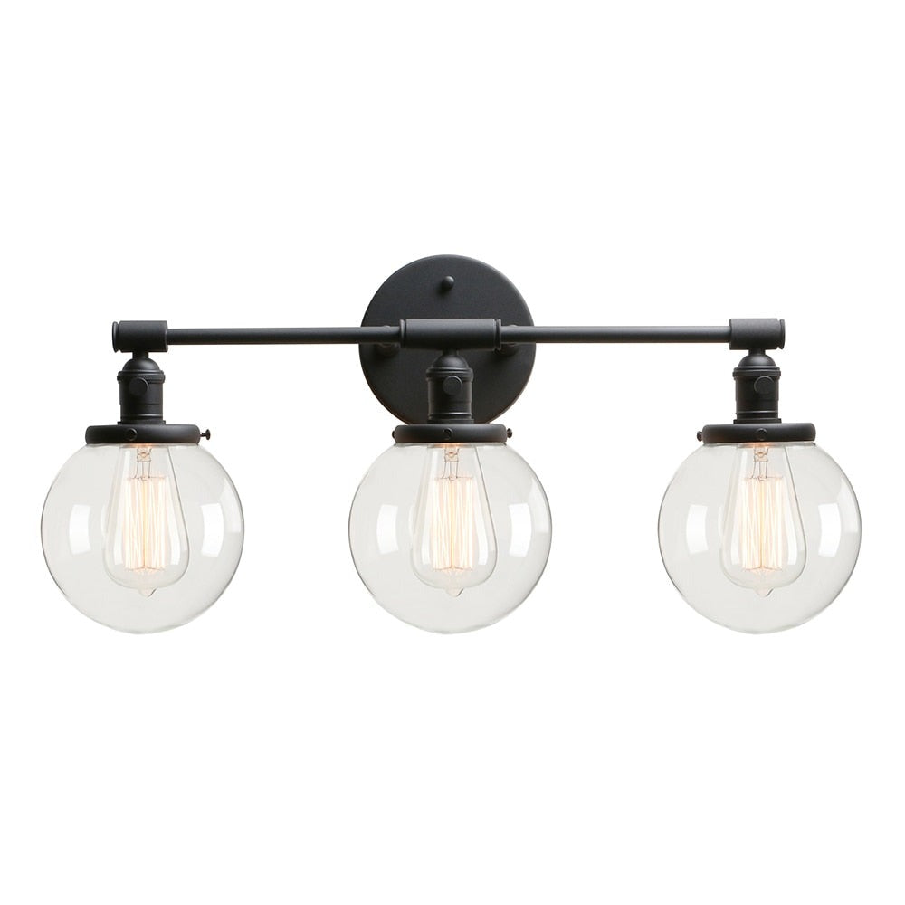 Three Light Bathroom Vanity Lighting with Clear Glass Globes shown in matte black