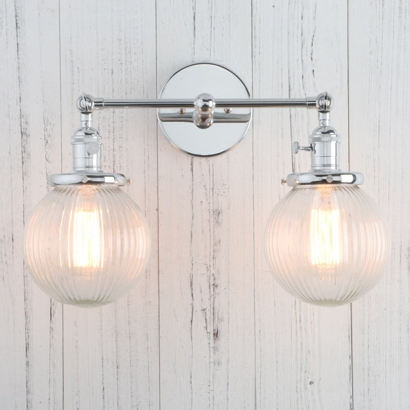 Vintage Double Wall Sconce with clear ribbed glass globes shown in chrome with lights on
