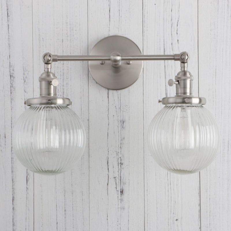 Vintage Double Wall Sconce with clear ribbed glass globes shown in nickel finish shown with lights off
