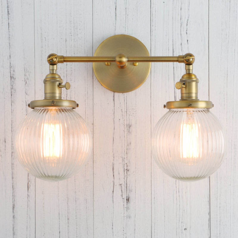Vintage Double Wall Sconce with clear ribbed glass globes shown in brushed gold