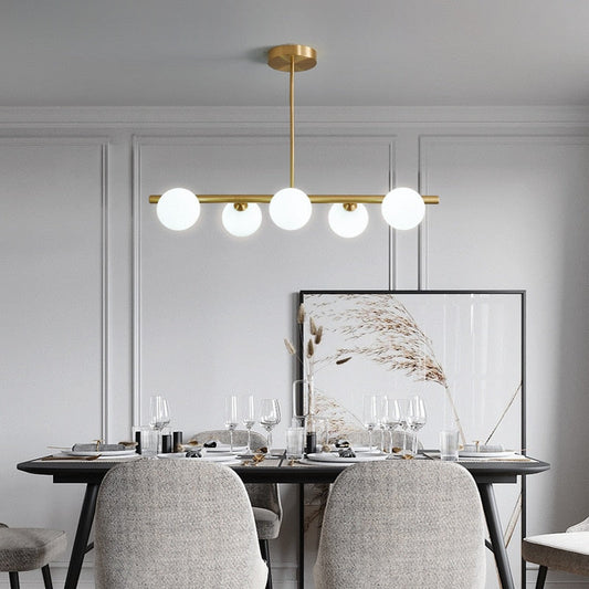 six bulb Glass Globe horizontal lighting shown in a  Dining Room 