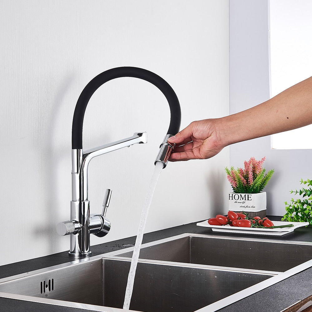 Kitchen Faucet with built in water filter in Chrome and Black shown in use