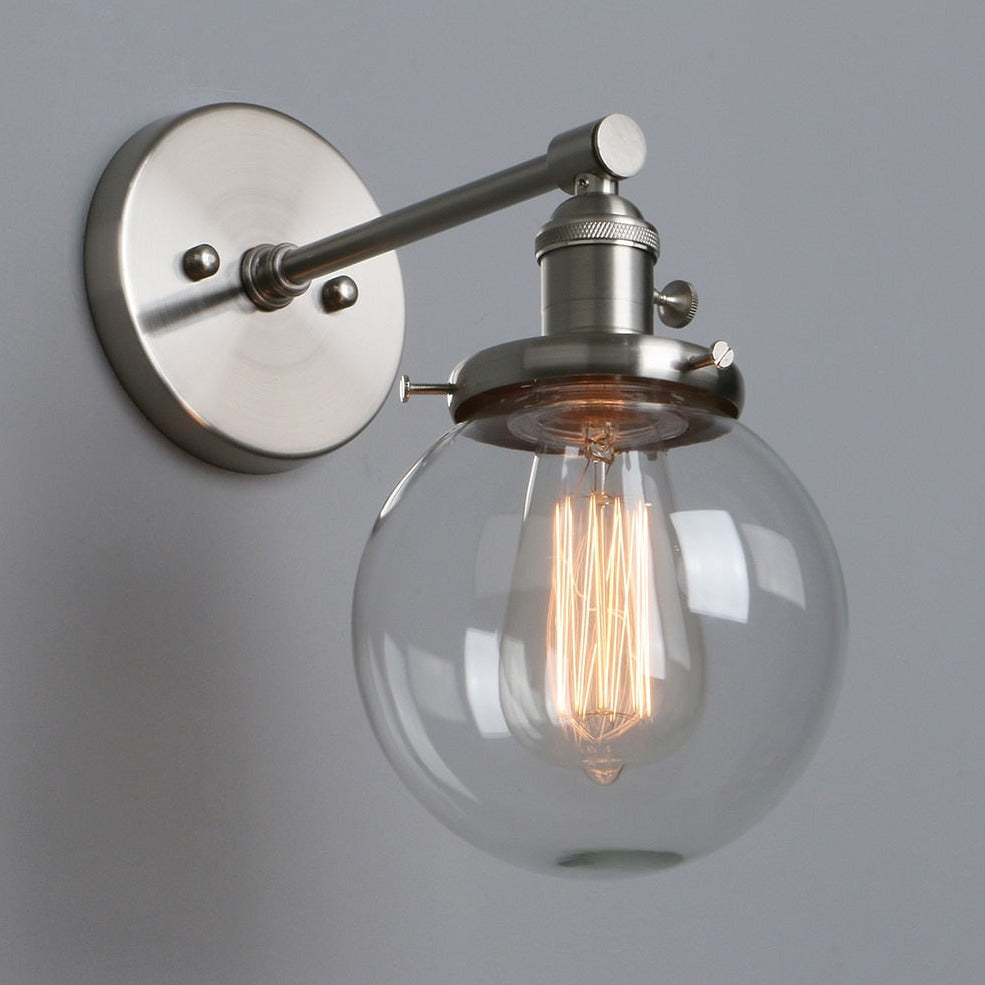 Vintage style wall sconce with nickel hardware with clear glass globe