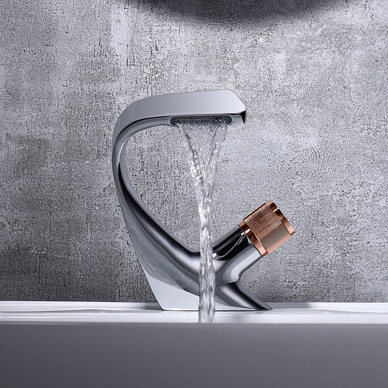 Modern Curved single hole deck mounted bathroom faucet shown in Chrome and Rose Gold 