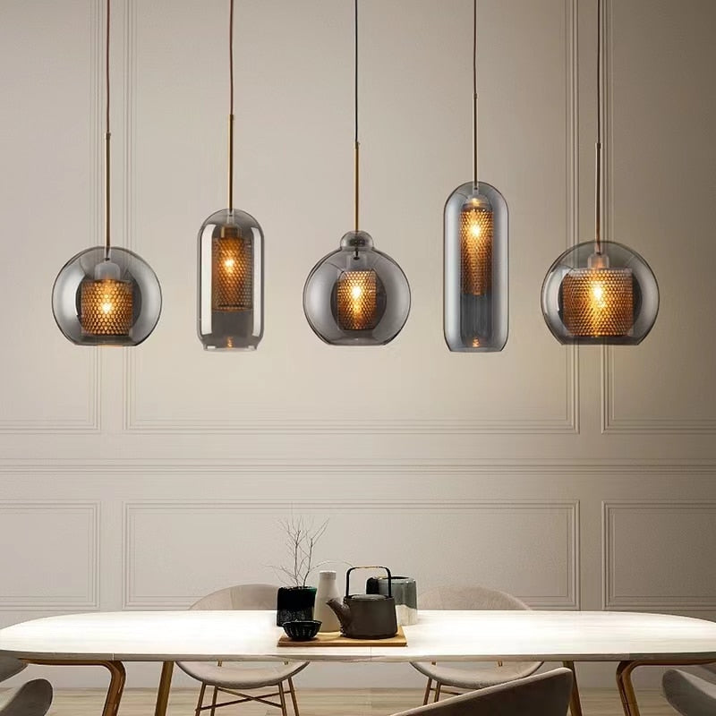 smoky grey glass pendants with honeycomb interior shade that casts a soft pattern of light shown in three different shapes