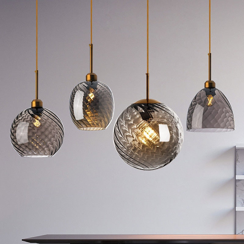 Collection of modern pedant lights with smoky grey glass globes