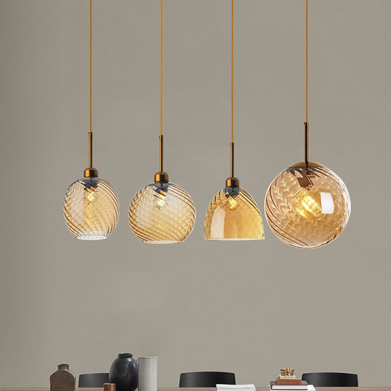 Selection of amber hanging pendant lights with amber shades