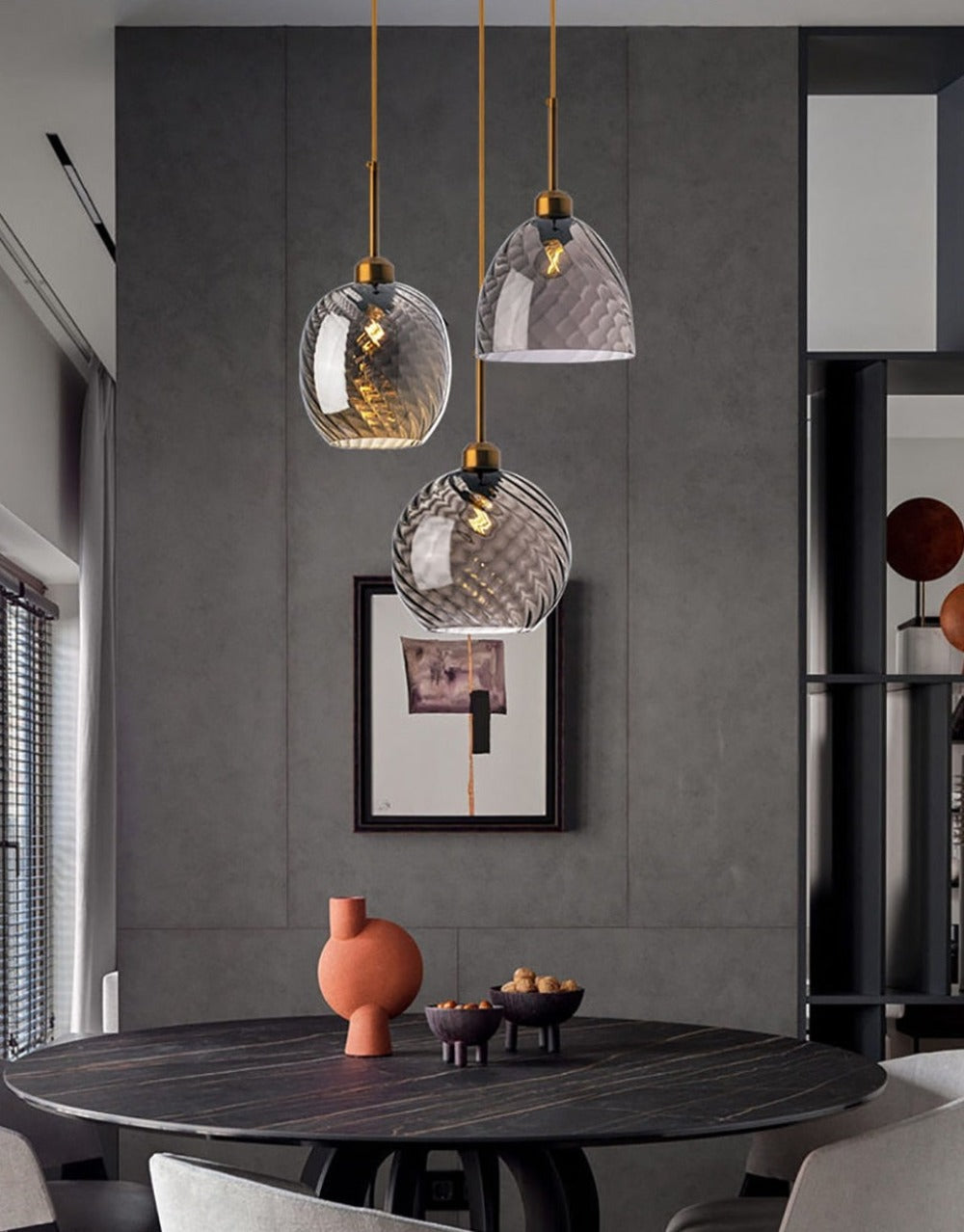 Pendant Light with Gray Glass Globe shown hung over a dining table