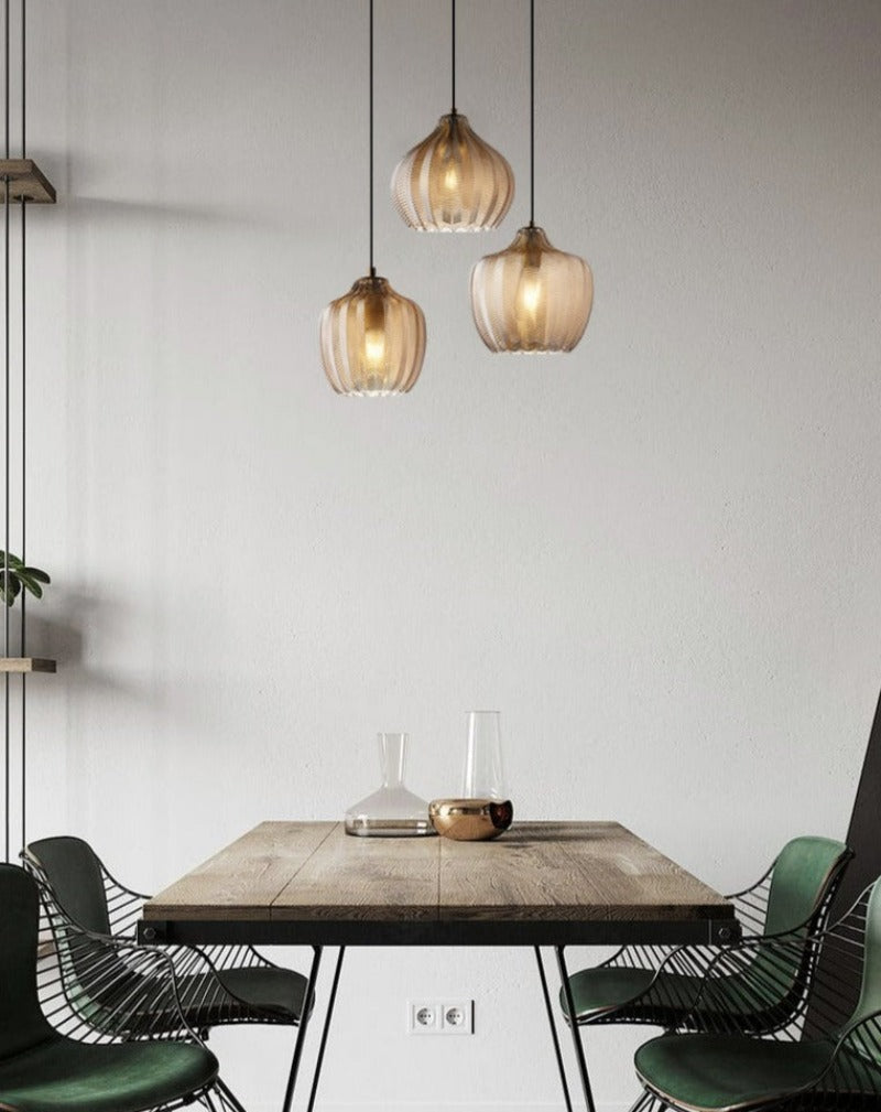 Chevron Patterned Textured Glass Pendant Lights in Amber Tint shown over kitchen table