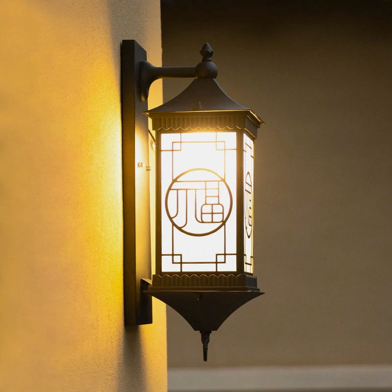 Close Up of Asian Inspired Outdoor Wall Lighting shown Lighted at Night