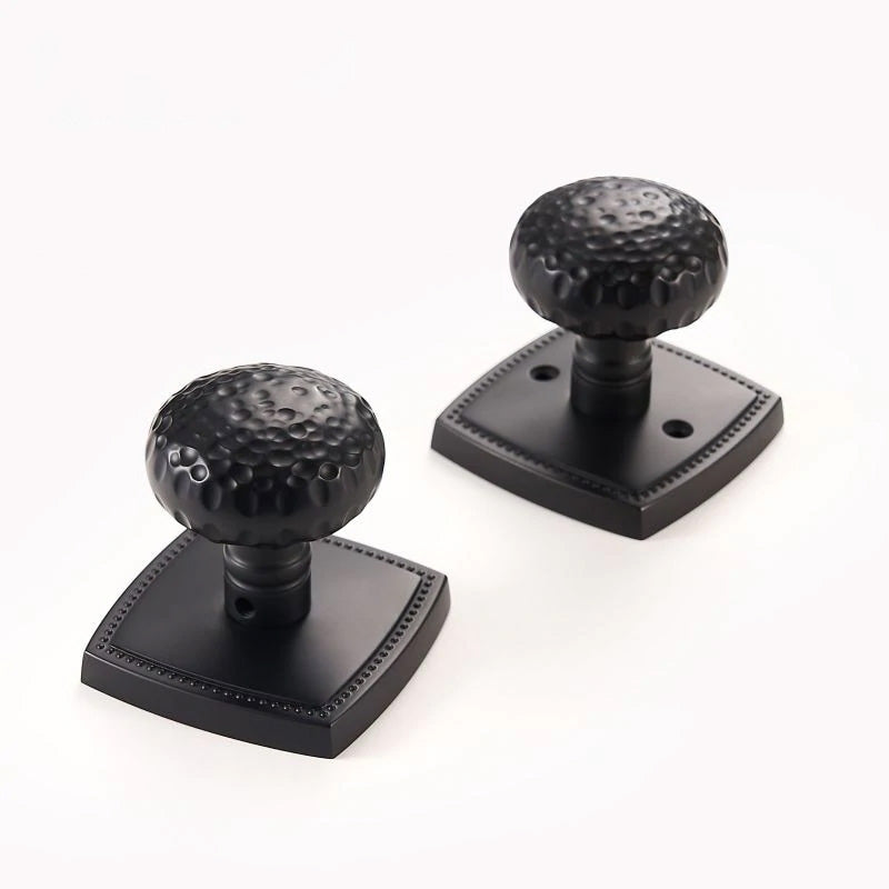 Black Privacy Door Knob set with Hammered finish shown in close up