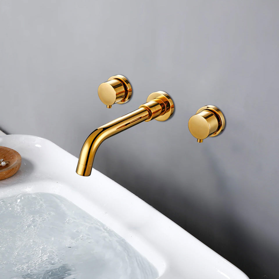 Side view of contemporary wall mounted bathroom sink faucet in polished gold shown above bathroom sink
