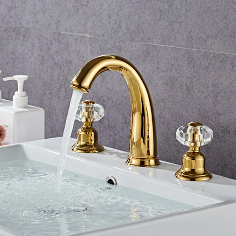Side View of Gold Bathroom Faucet, three hole, widespread, deck mounted with faceted crystal handles
