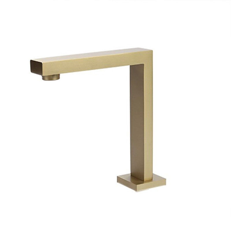 Closeup of modern square bathroom faucet in brushed gold finish
