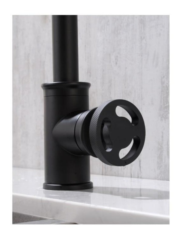 Industrial kitchen faucet handle close up view shown in matte black finish