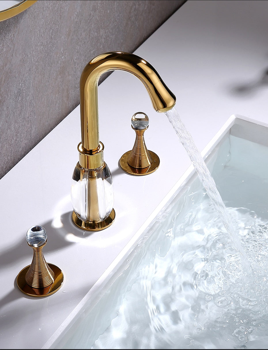 Side view of elegant gold and resin eight inch spread bathroom faucet