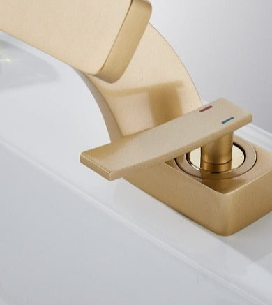 handle details of SIngle hole modern curved faucet in brushed gold finish