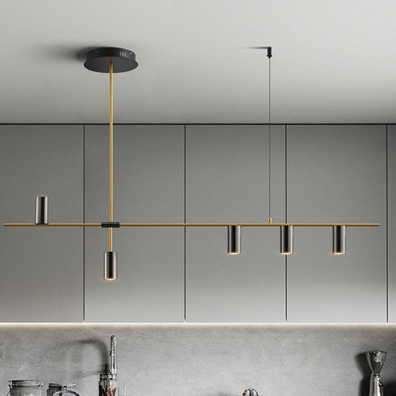 Modern horizontal chandelier shown over kitchen island