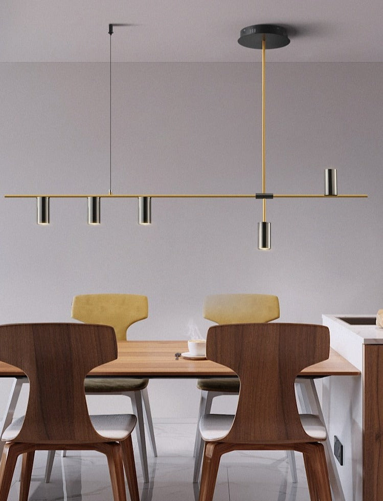 Modern horizontal chandelier shown over modern dining room table