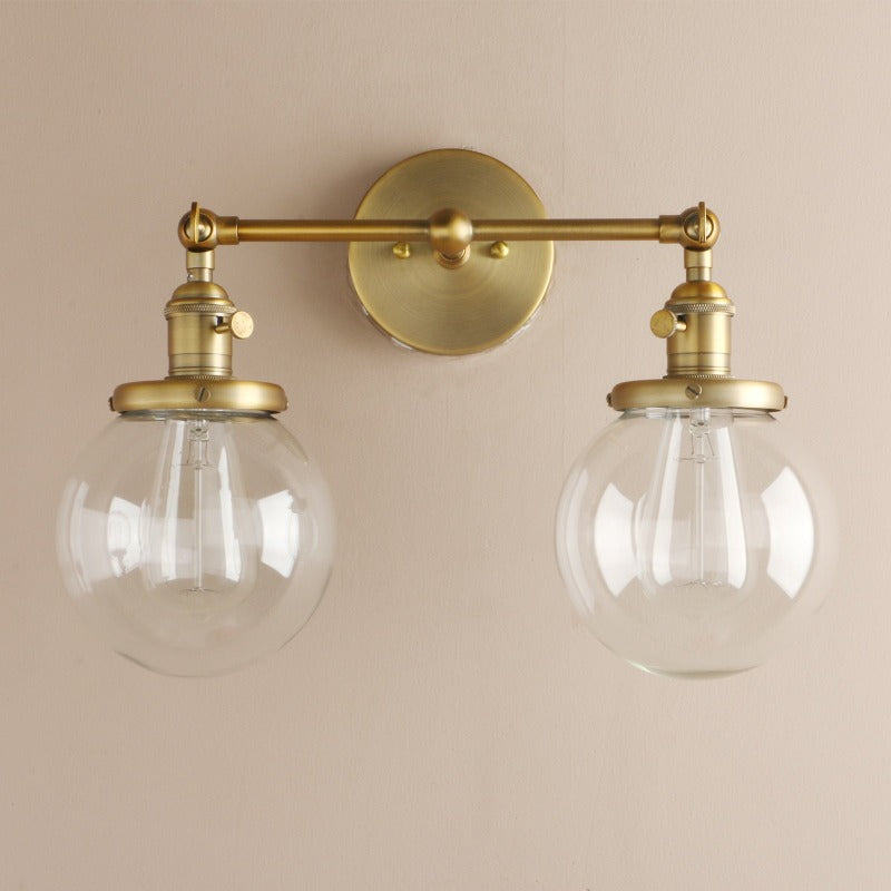 Vintage farmhouse Style Double Globe Wall Sconce shown in Brushed Gold Finish