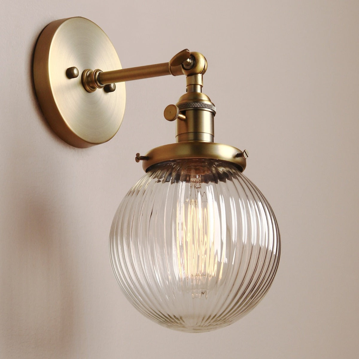 Vintage style Farmhouse Wall Sconce, ribbed Clear Glass Globe in brushed gold finish