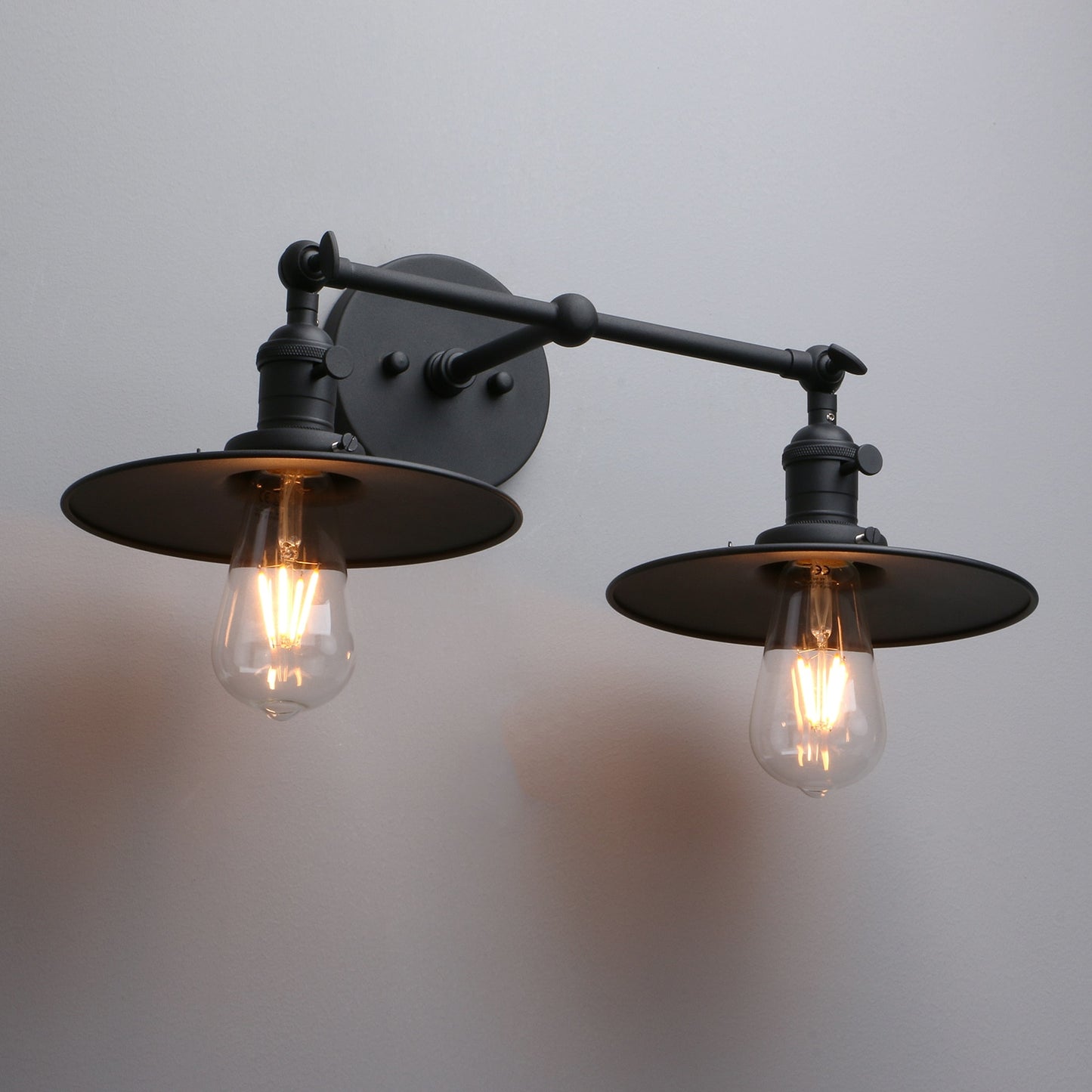 Vintage style double wall sconce with flat shade and edison bulb in black