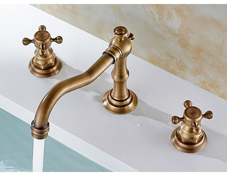 Vintage Style Bathroom Faucet with Cross Handles shown in Antique Bronze